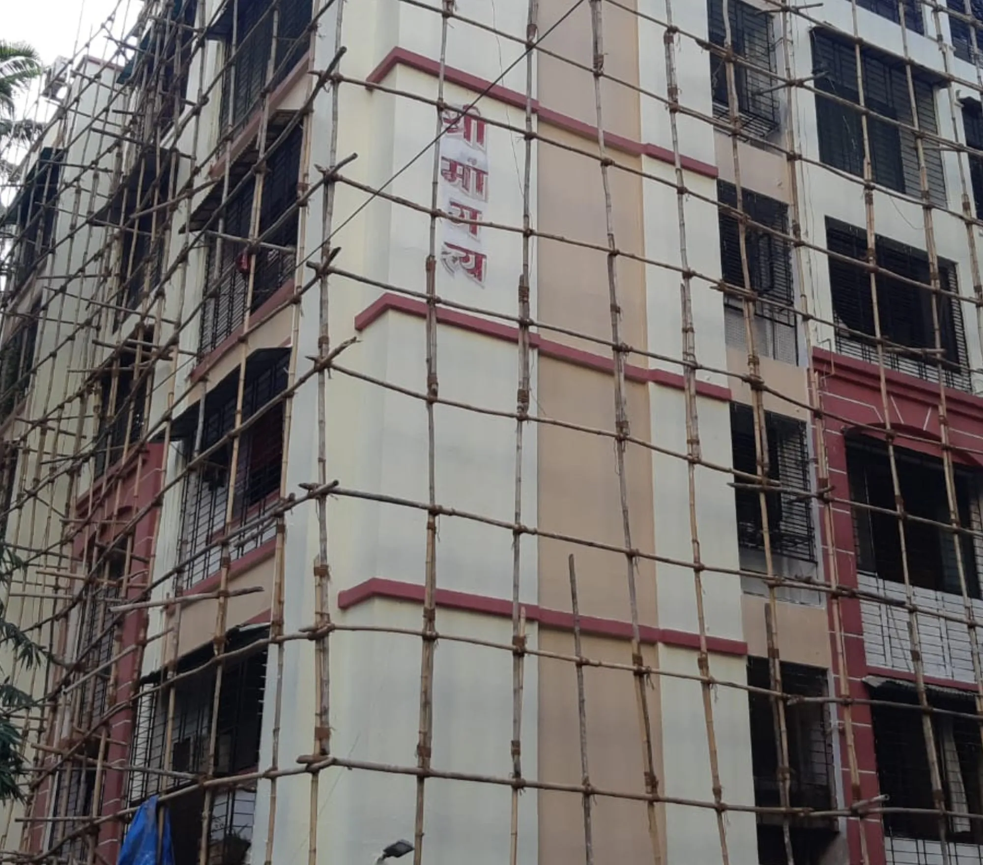 Exterior building painting in progress on a Thane housing society — Mahadev Waterproofing