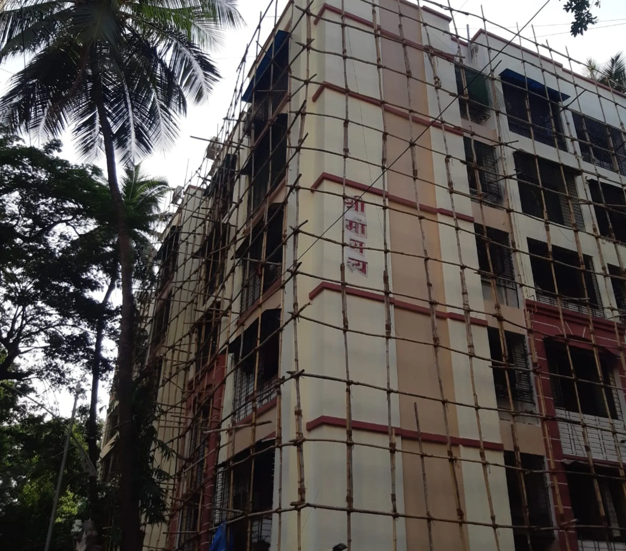 Phased waterproofing and facade work on a housing society building in Thane — Mahadev Waterproofing