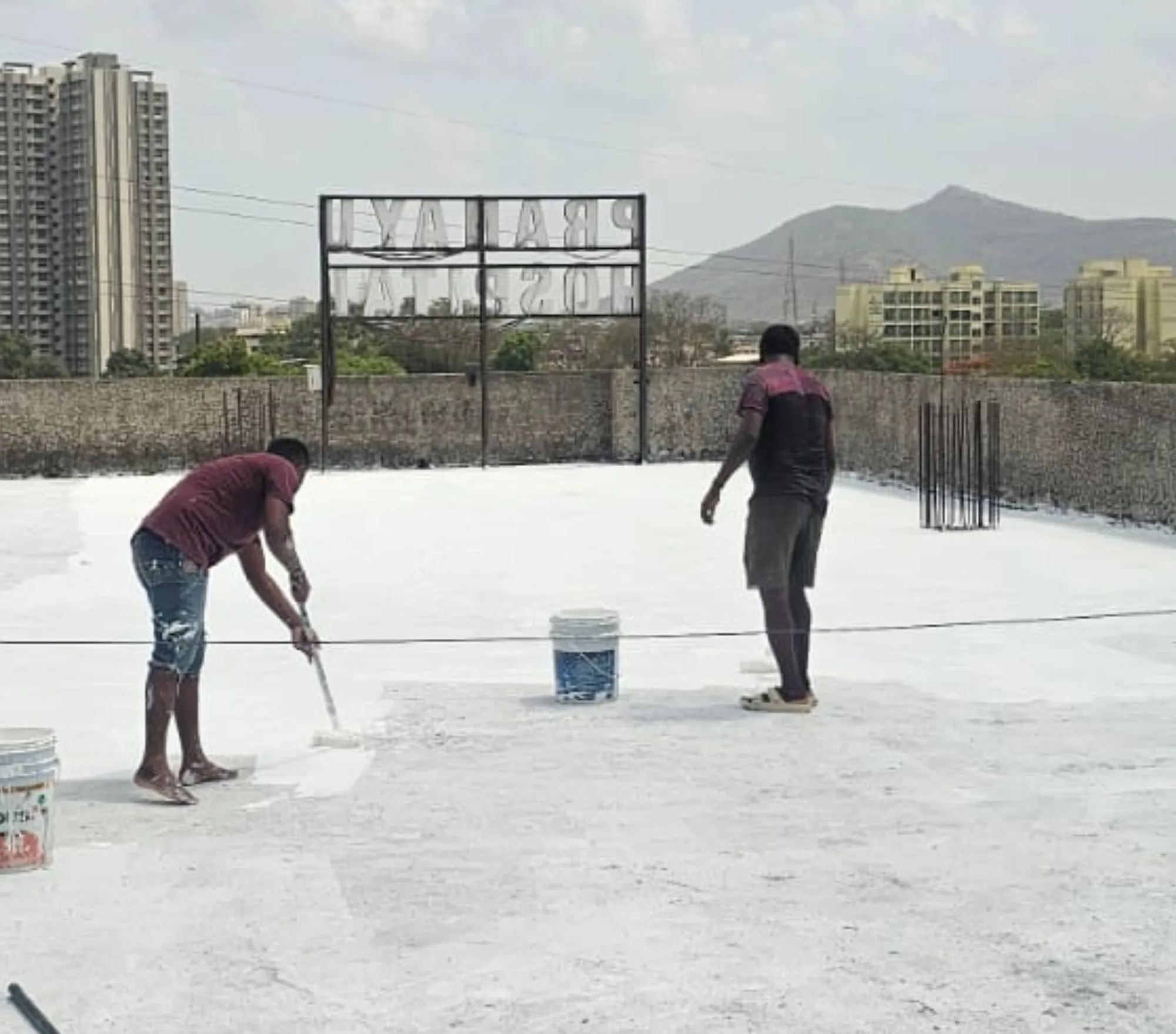 Waterproofing chemical coating applied to a roof slab in Mumbai — Mahadev Waterproofing