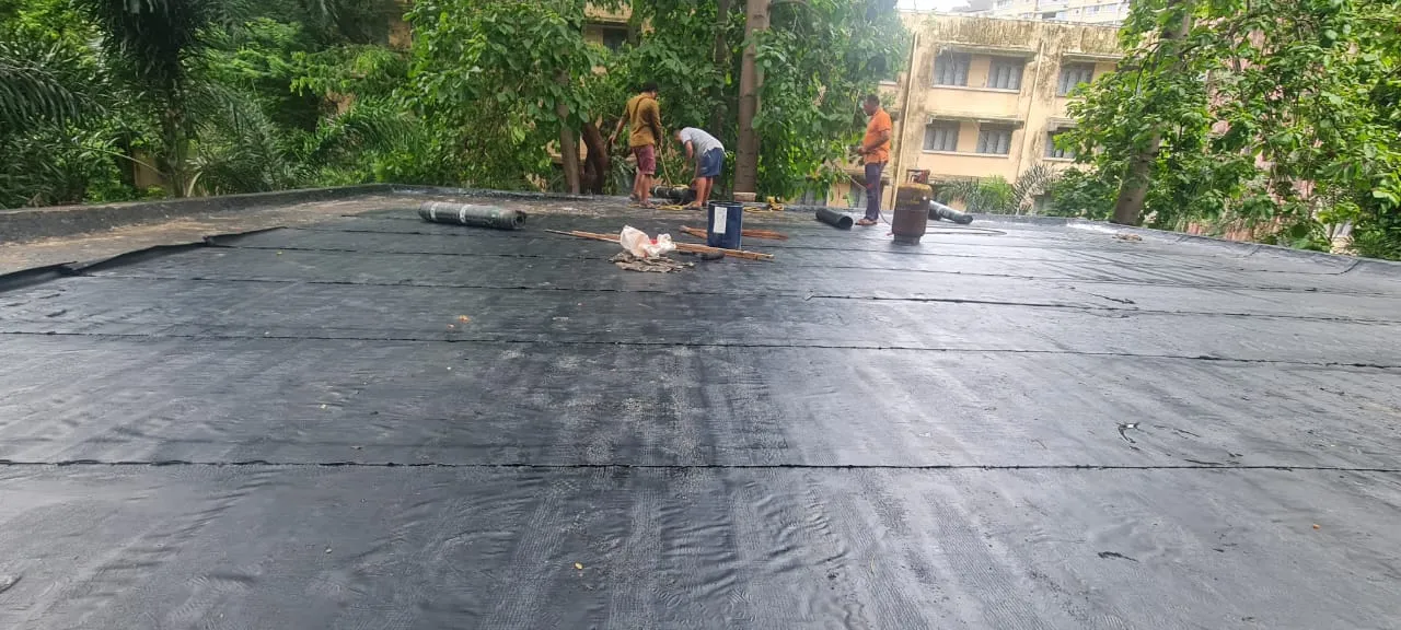 Waterproofing work in progress on a Mumbai building terrace — Mahadev Waterproofing