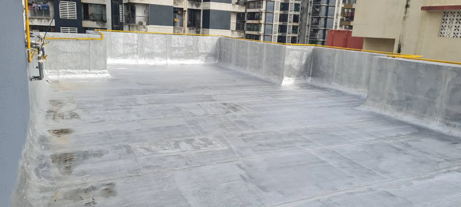 Silver coating over membrane — waterproofing project in Thane & Mumbai by Mahadev Waterproofing