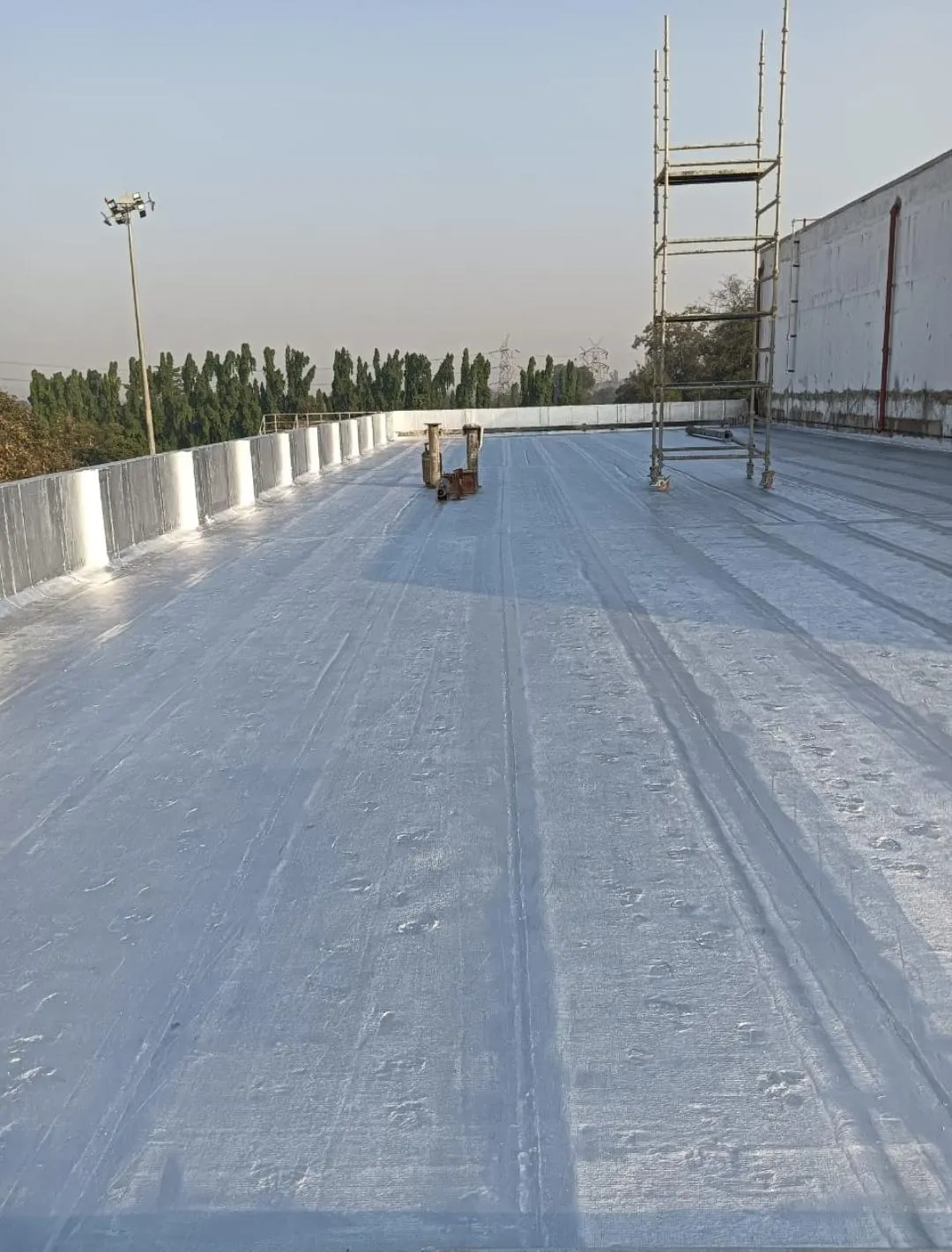 Silver coating over membrane — waterproofing project in Thane & Mumbai by Mahadev Waterproofing